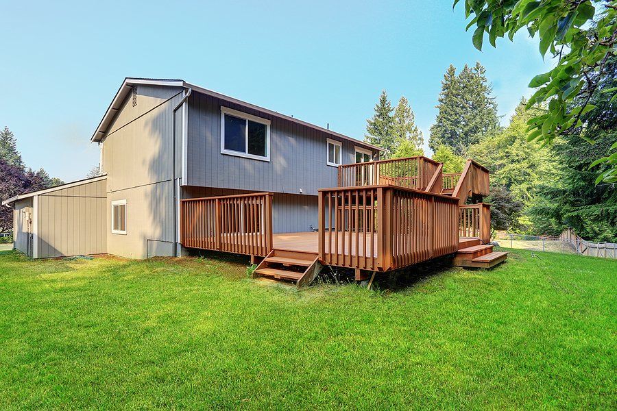 a house with wooden deck elgin fence company