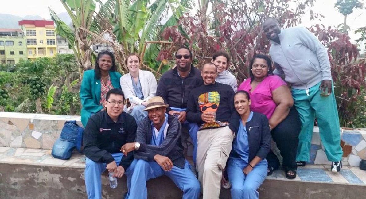 A group of people are posing for a picture together