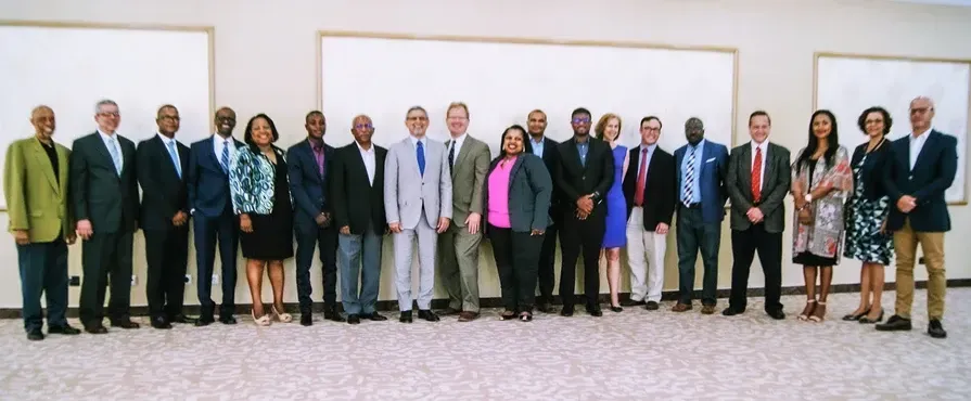 A group of people posing for a picture in a room