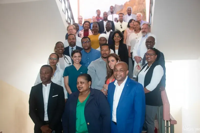 A group of people are posing for a picture on a set of stairs.