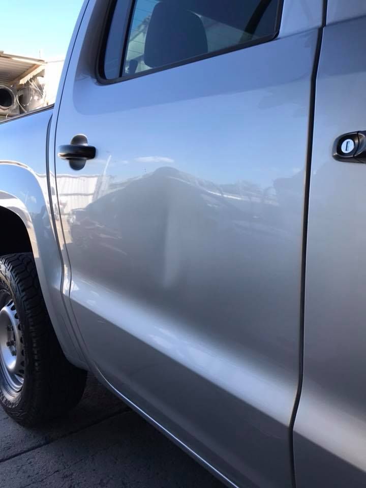 A Silver Truck is Parked on the Side of the Road — Dek-A-Dent Townsville In Wulguru, QLD