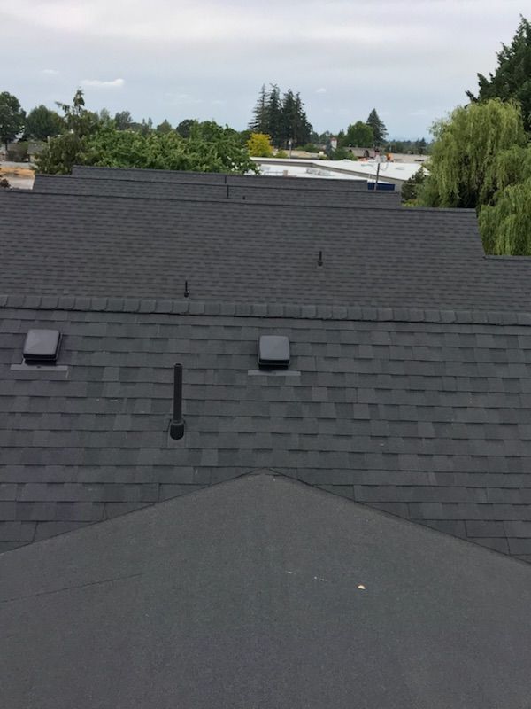 The roof of a house with a lot of shingles on it.