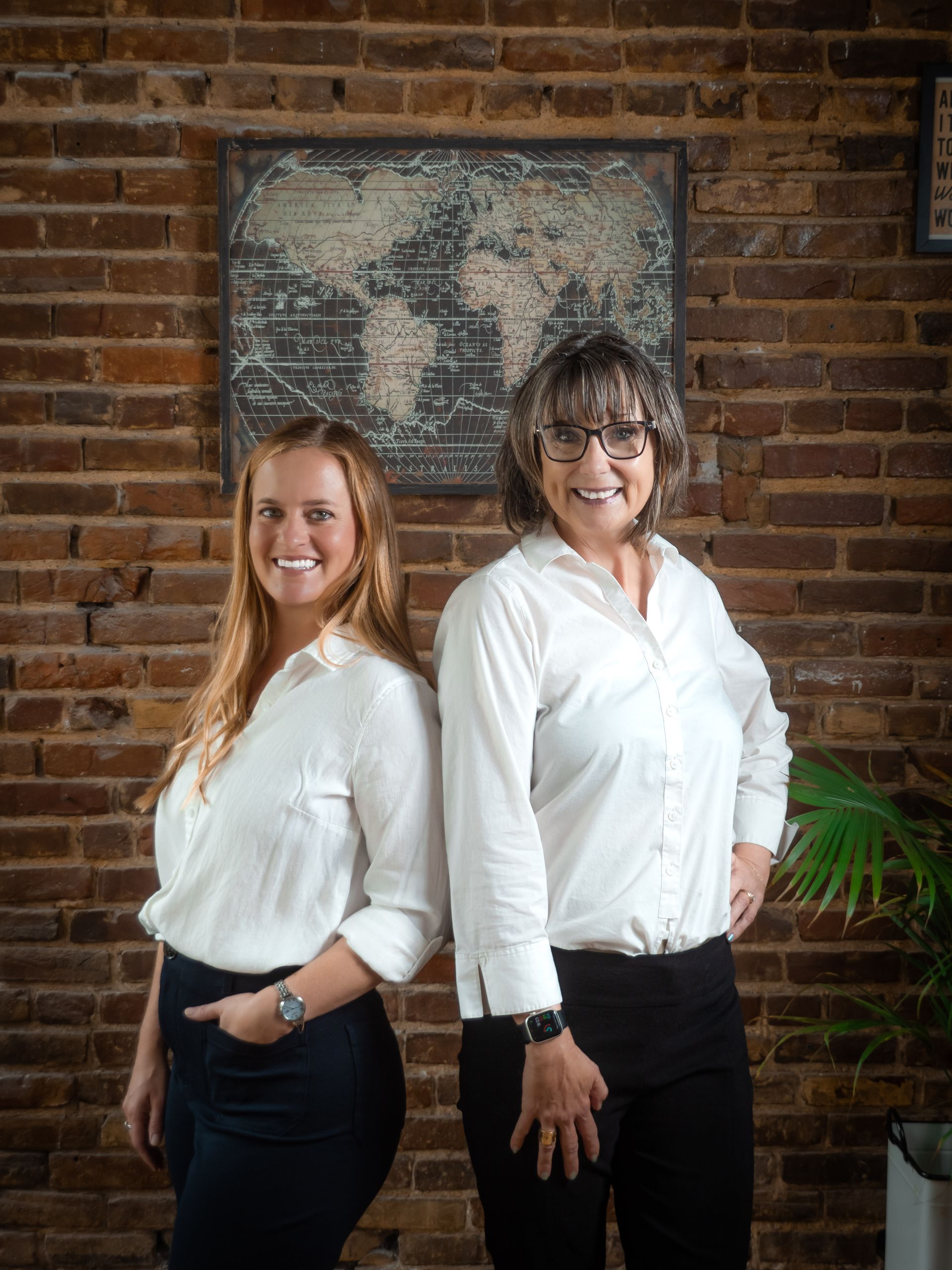 A woman in a red beret is holding a sign that says travel