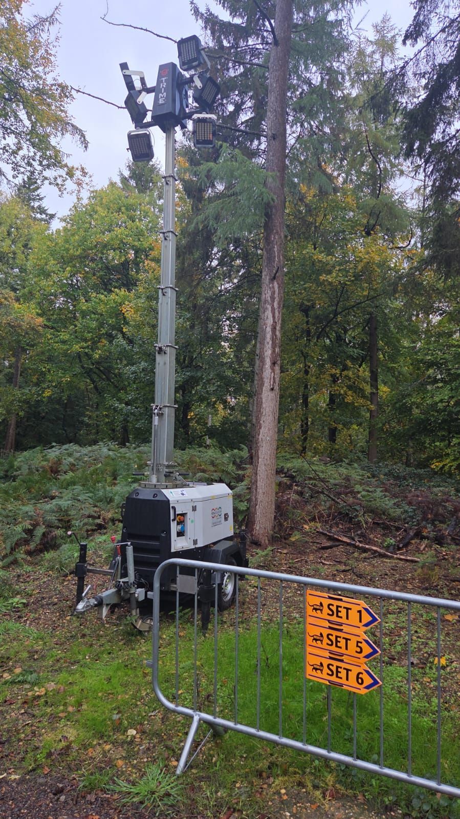 Electrical meters on a concrete wall, some with green streaks; pipes run below.