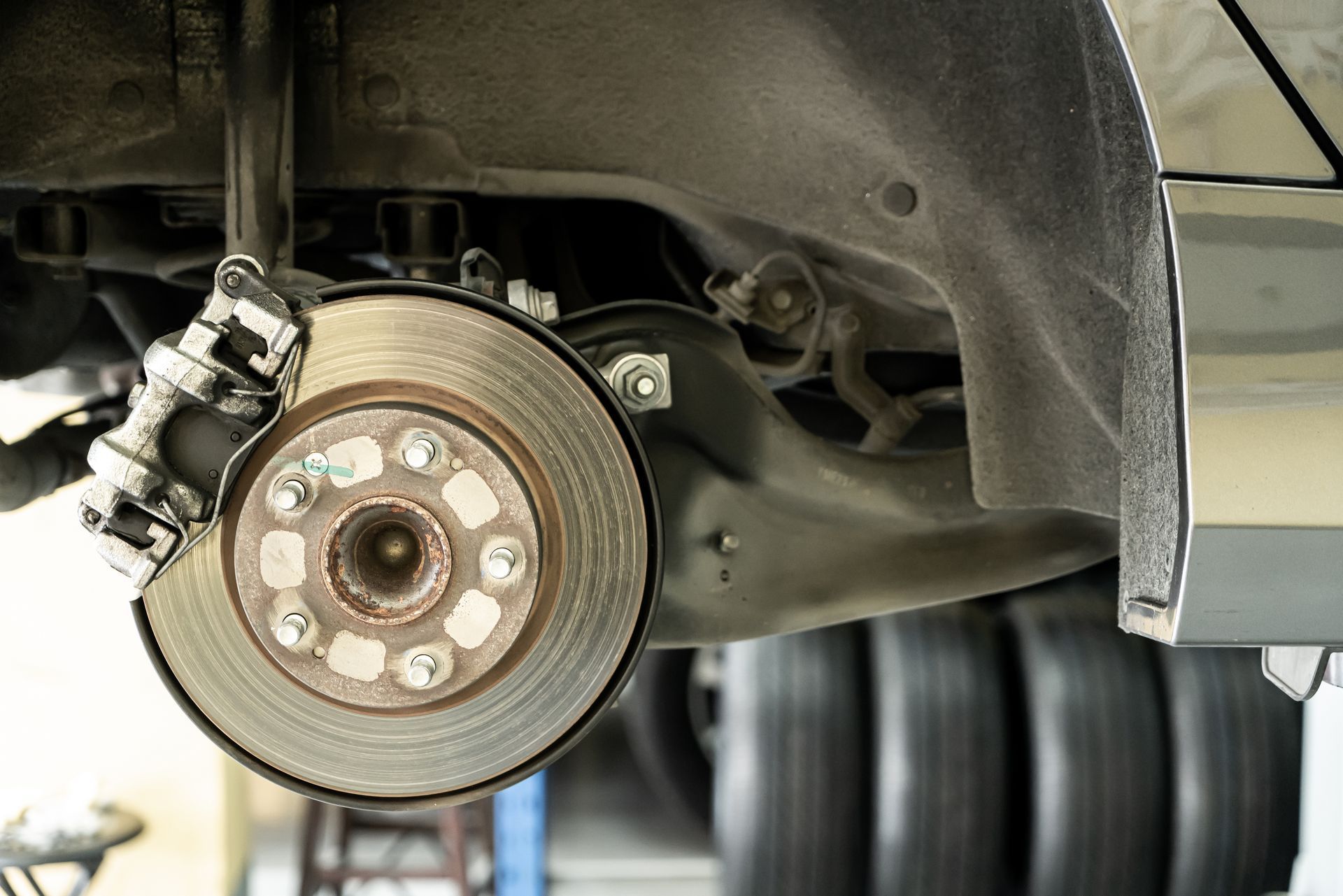 vehicle brakes being inspected