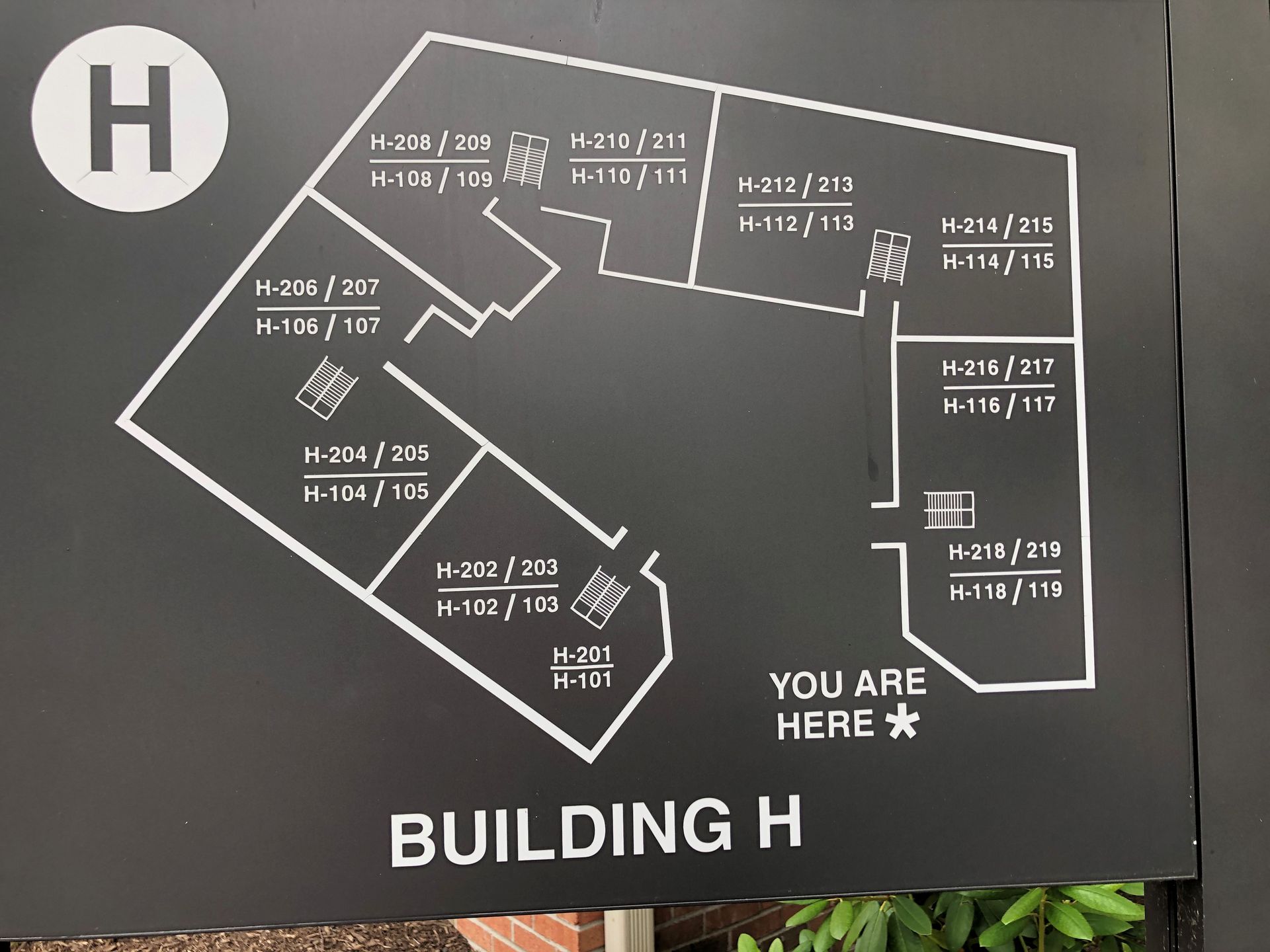 Building H floor plan, black background, white text. Shows room numbers and 