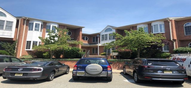 Blue Vehicle On Parking Lot — Clifton, NJ — Evergreen Commercial Real Estate Brokers Inc
