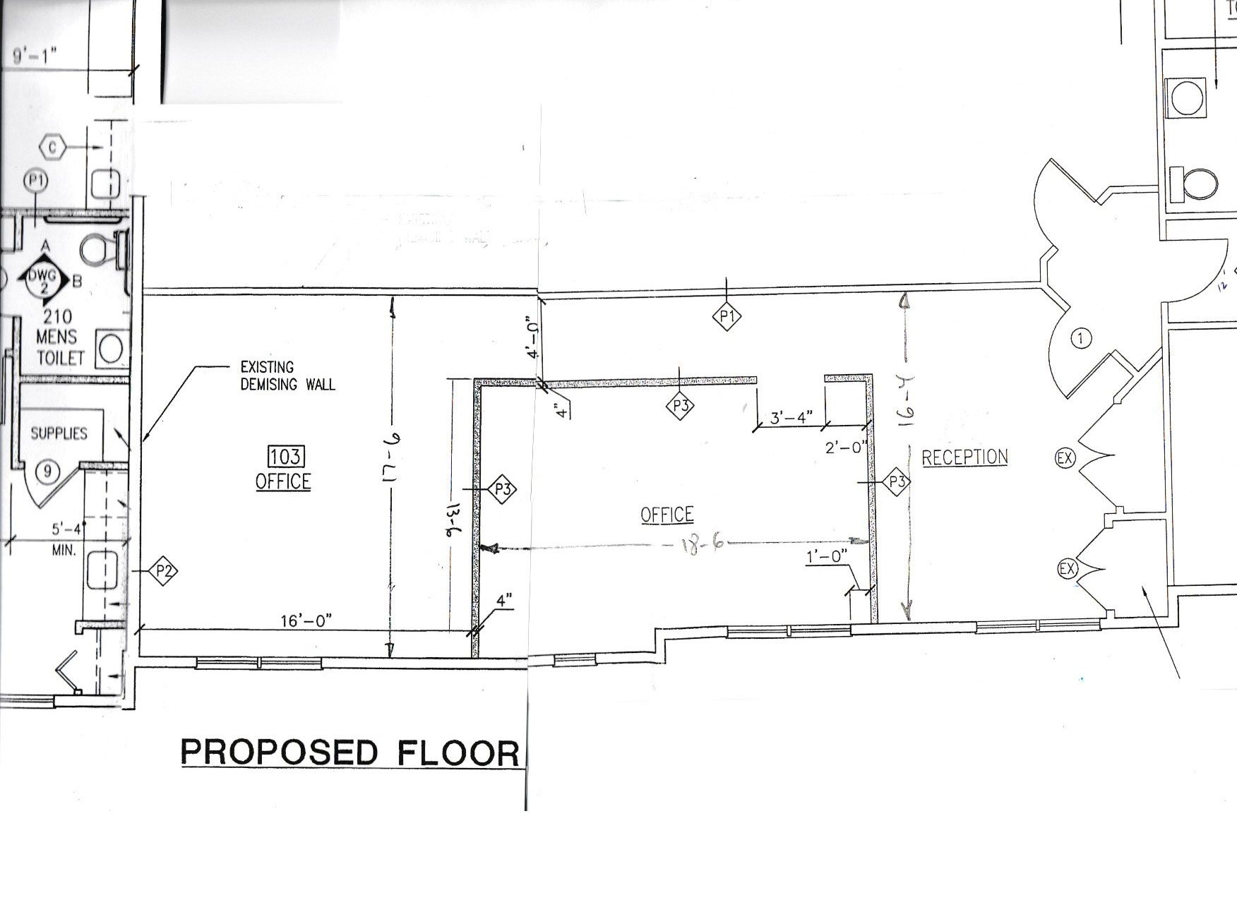 Architectural floor plan showing the proposed layout of a room, including restrooms, a storage area, and a kitchen.