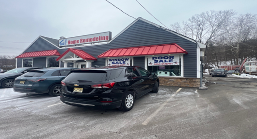 A gas station with an arrow pointing to the right.