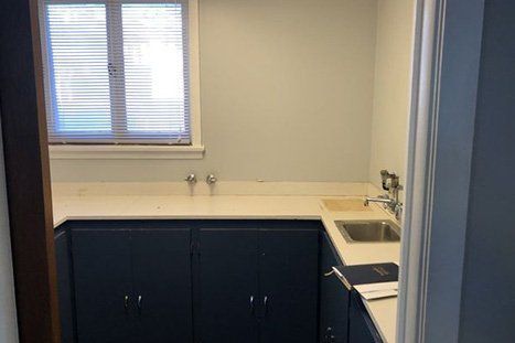 Countertop With Blue Cabinets — Clifton, NJ — Evergreen Commercial Real Estate Brokers Inc