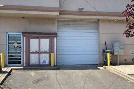 White Warehouse Door — Clifton, NJ — Evergreen Commercial Real Estate Brokers Inc