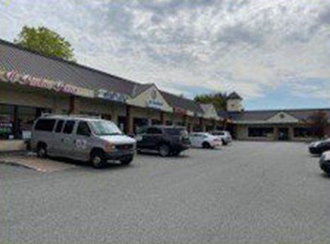 Vehicles Parked Infront Of Stores In Plaza — Clifton, NJ — Evergreen Commercial Real Estate Brokers Inc