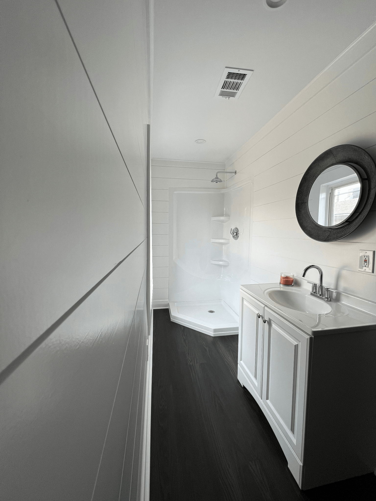 A bathroom with a sink and a mirror on the wall