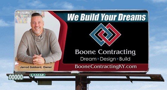 A billboard for boone contracting says we build your dreams
