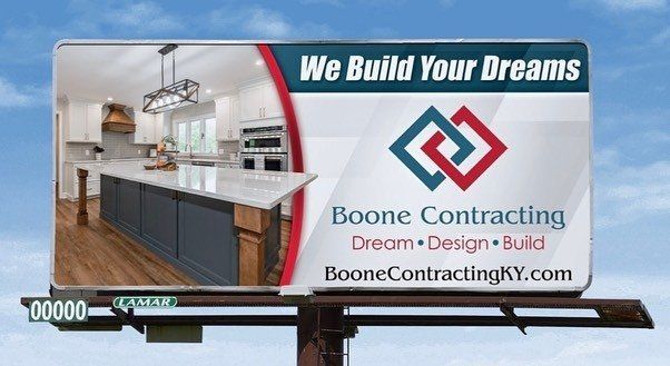 A billboard for boone contracting says we build your dreams