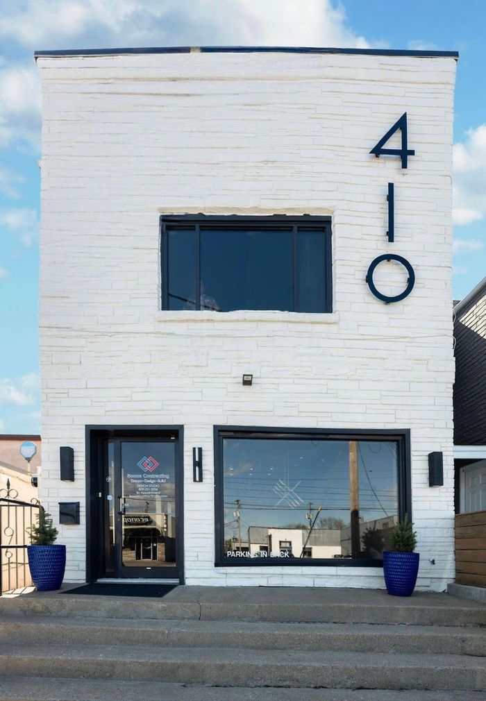 A large brick building with the number 410 on it