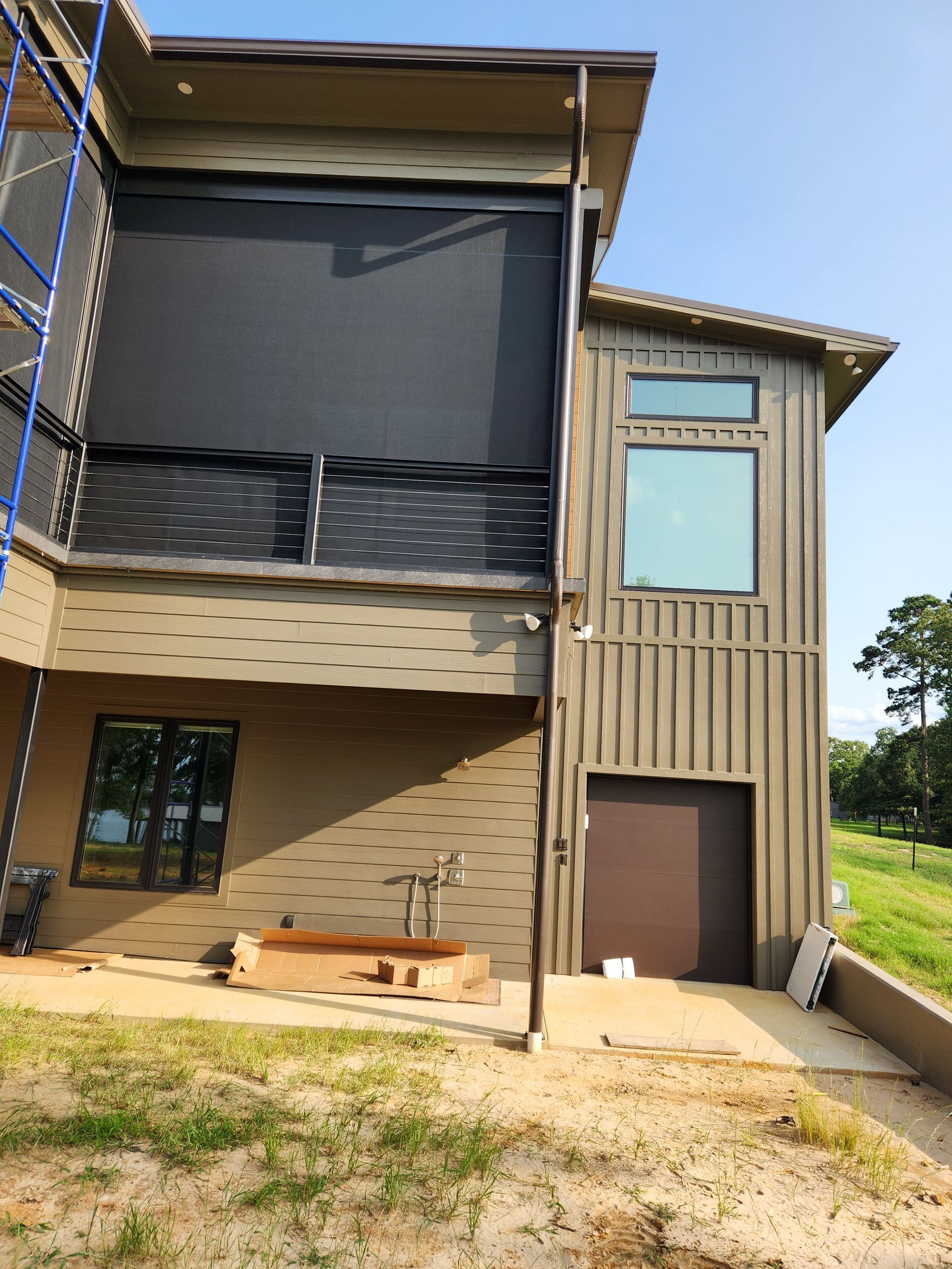 A large house with a lot of windows is being built