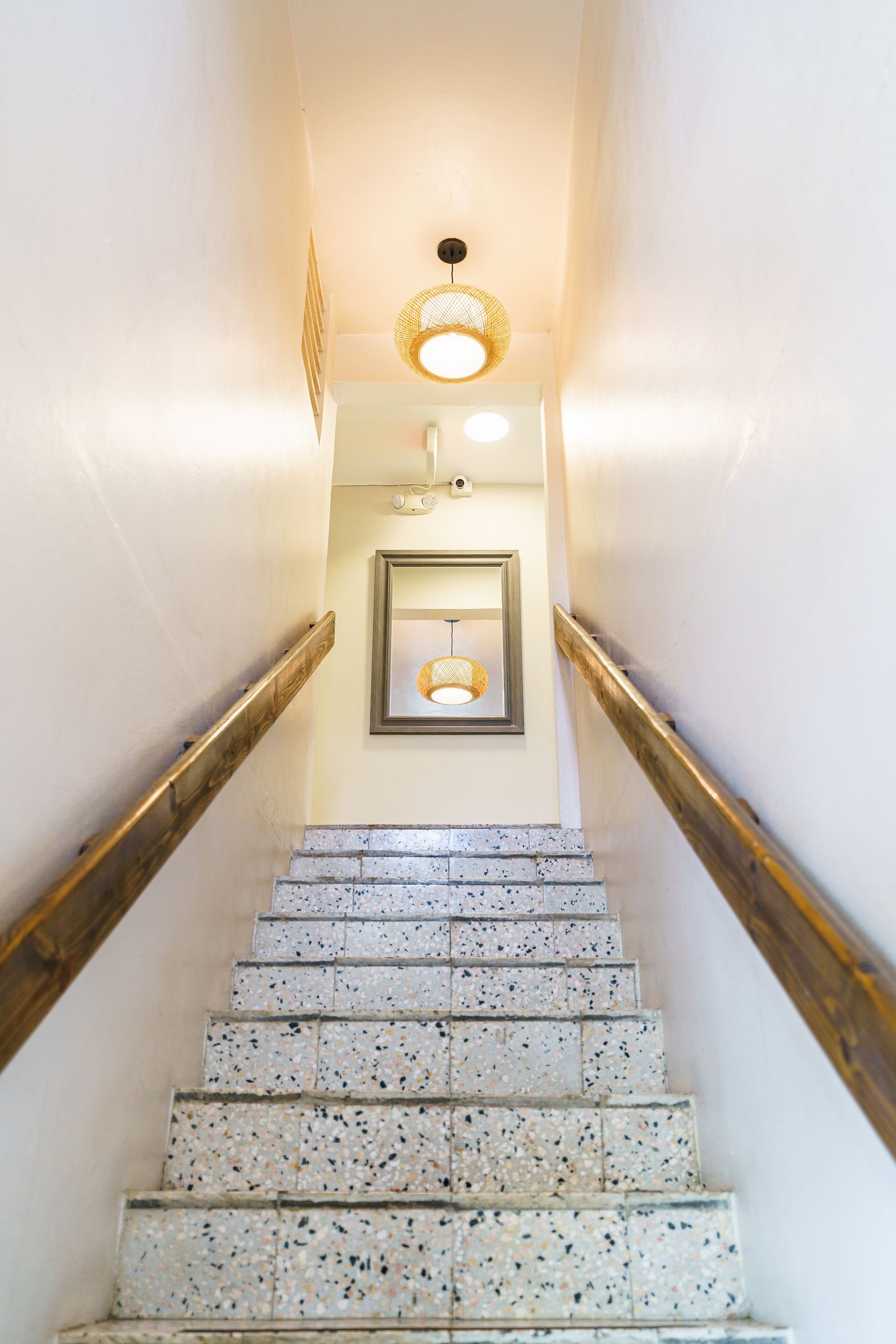 A set of stairs leading up to the second floor of a building.