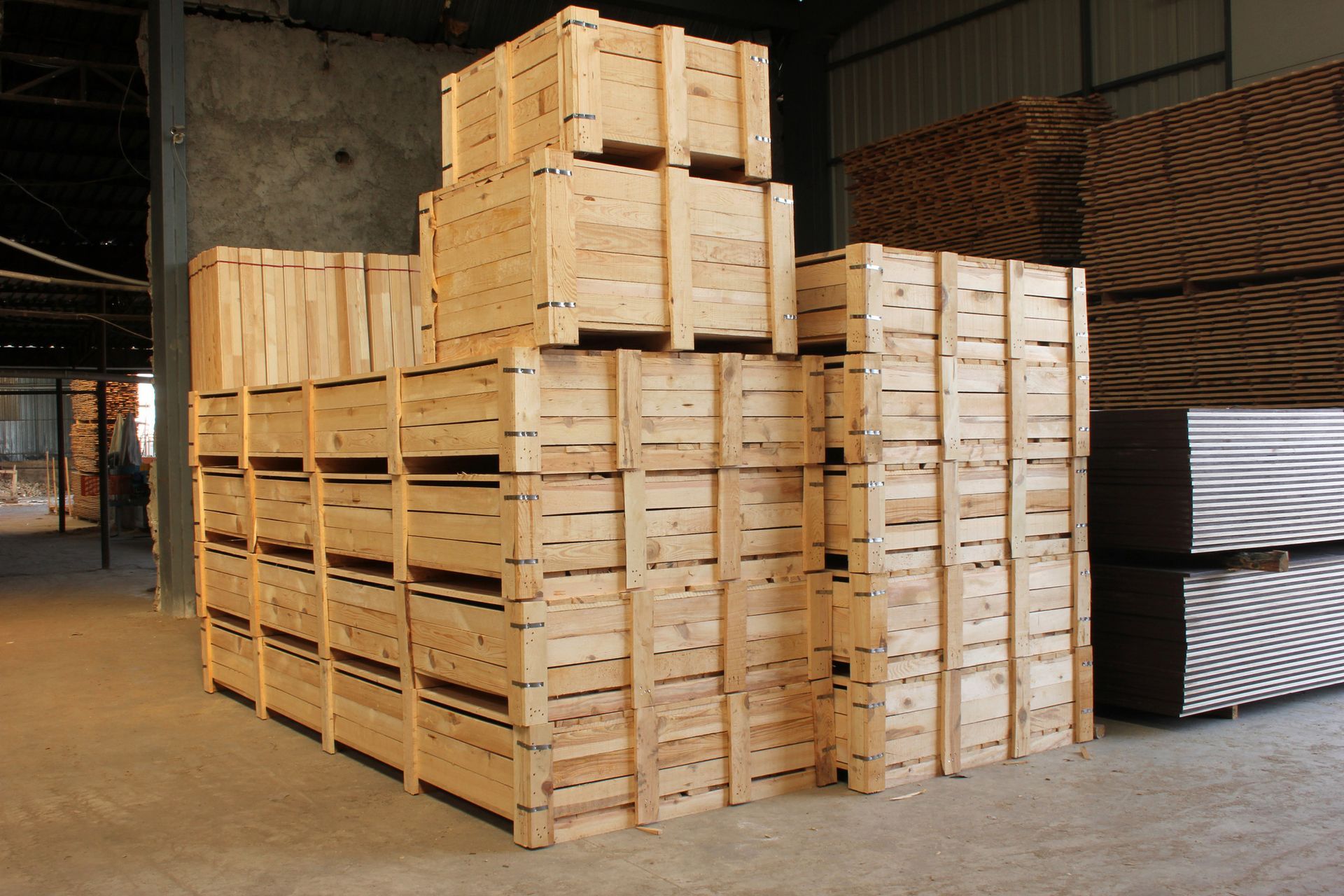 A warehouse filled with wooden crates stacked on top of each other.