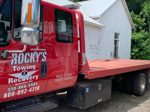 Red Towing Truck — Waynesburg, OH — Rocky’s Auto & Truck Parts