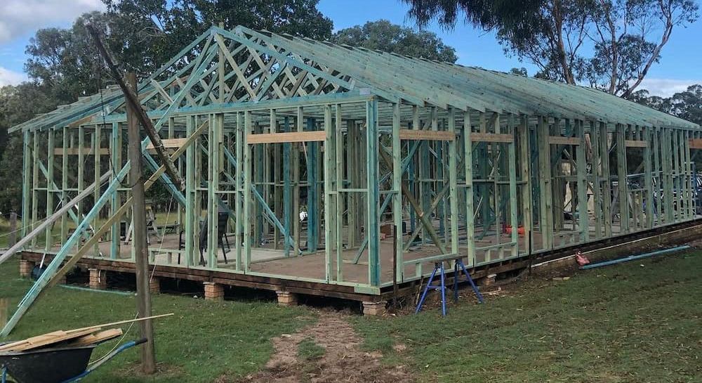 A Large House is Being Built in the Middle of a Grassy Field — East Maitland Building In Port Stephens, NSW