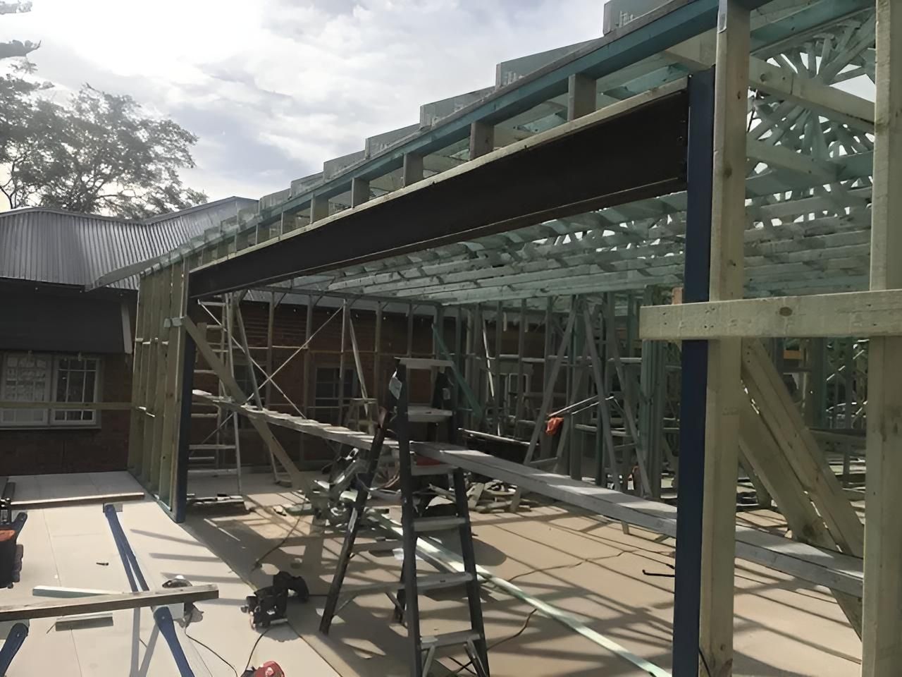 A Ladder is Sitting in Front of a Building Under Construction — East Maitland Building In Newcastle, NSW