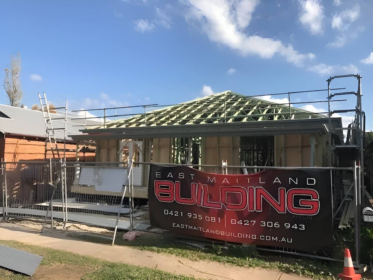 A Building Under Construction With a Sign That Says Building on It — East Maitland Building In Maitland, NSW
