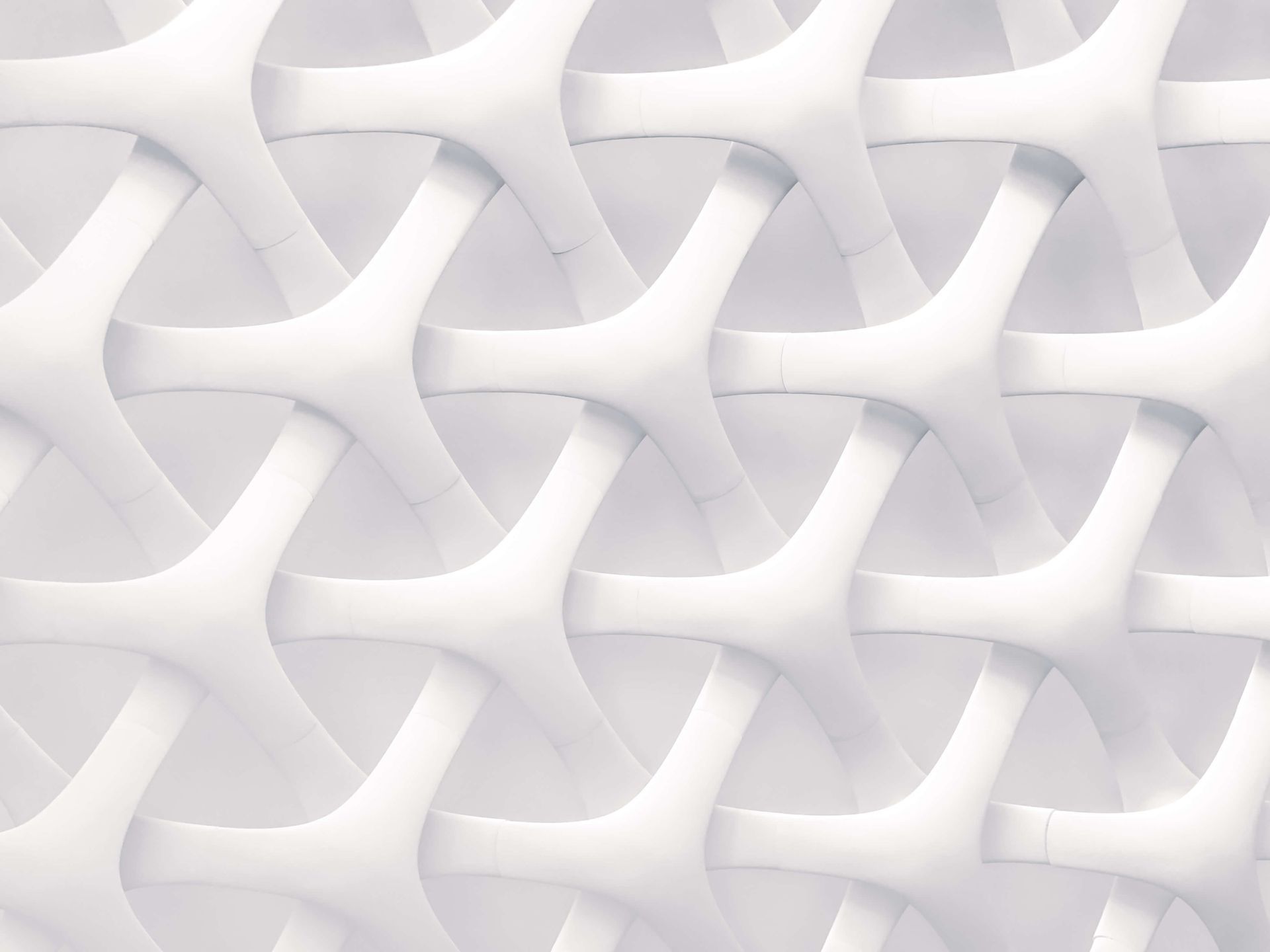 A close up of a white geometric pattern on a wall.