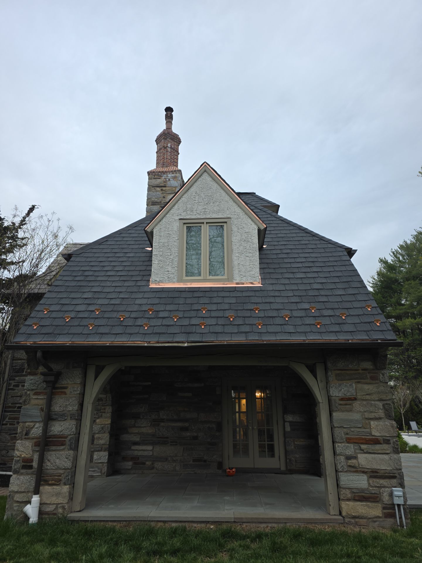 Phot of chimney on the roof of a house after repair.
