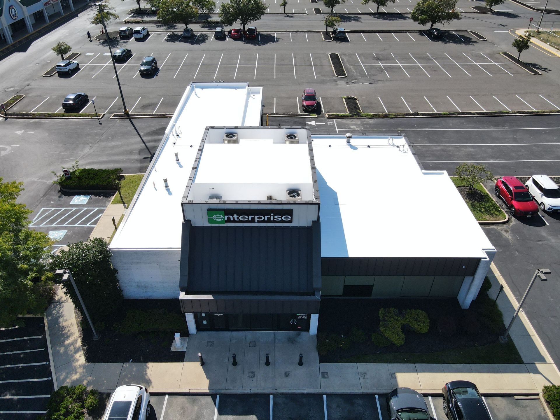 Photo of a commercial building with a new roof installed by Essential Exteriors.
