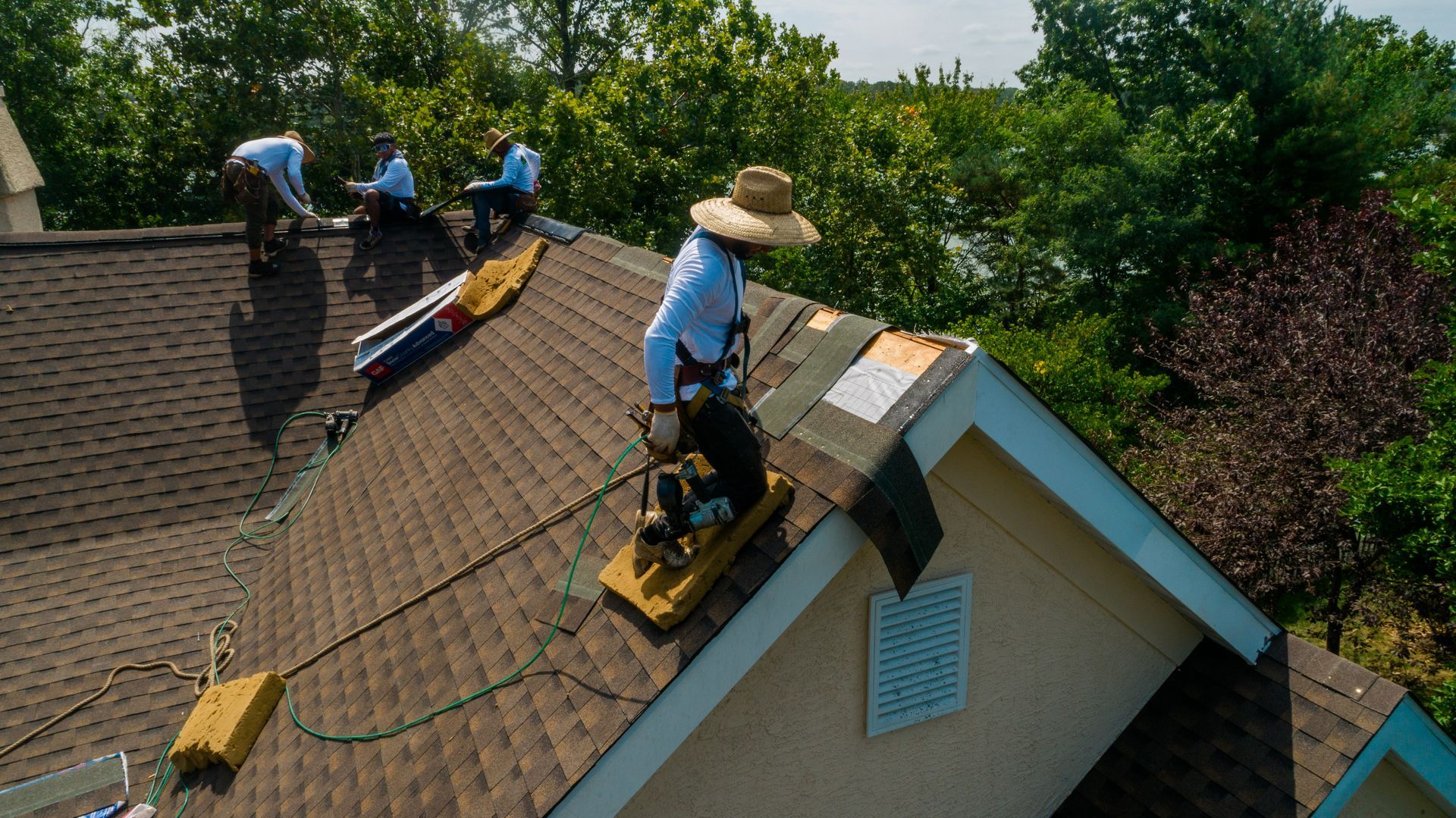 Aerial photo of house with a roof being replaced.