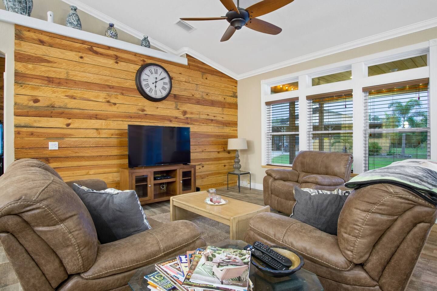 There is a clock on the wall in the living room.