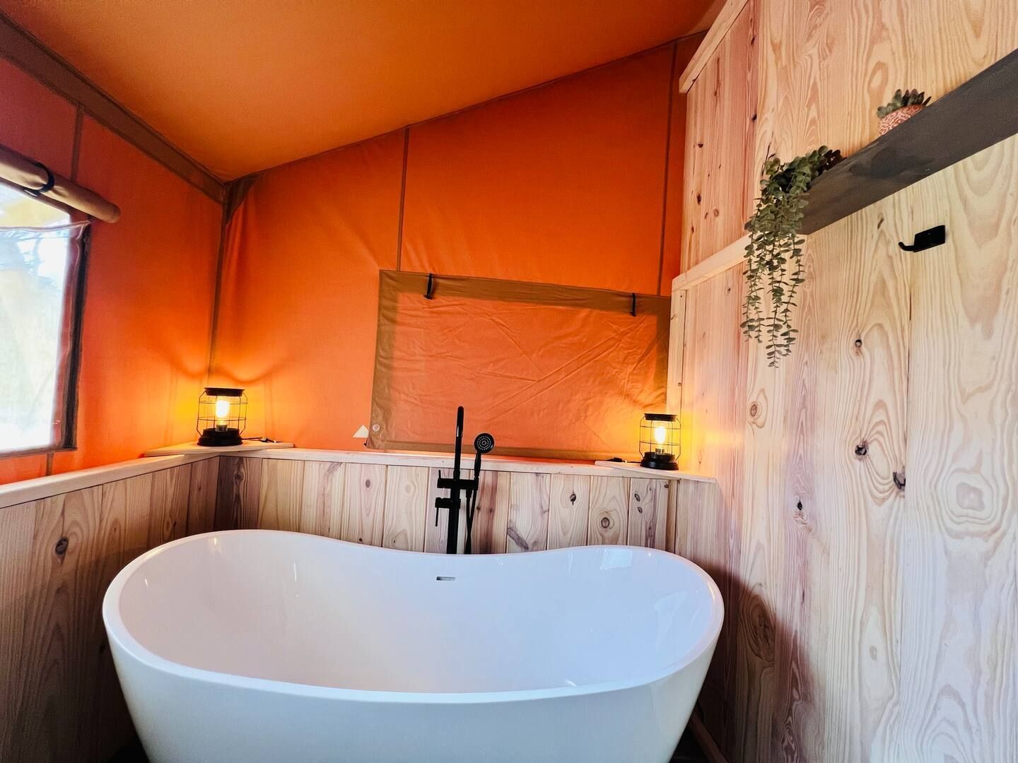 A bathroom with a large bathtub in the middle of it.