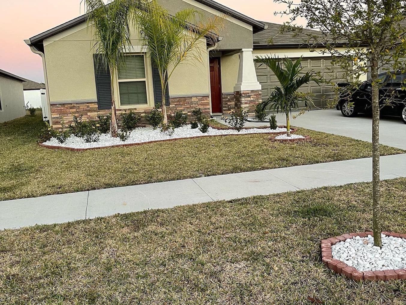 A house with a car parked in front of it.