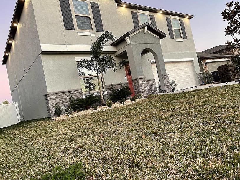 A large house with a lot of grass in front of it.