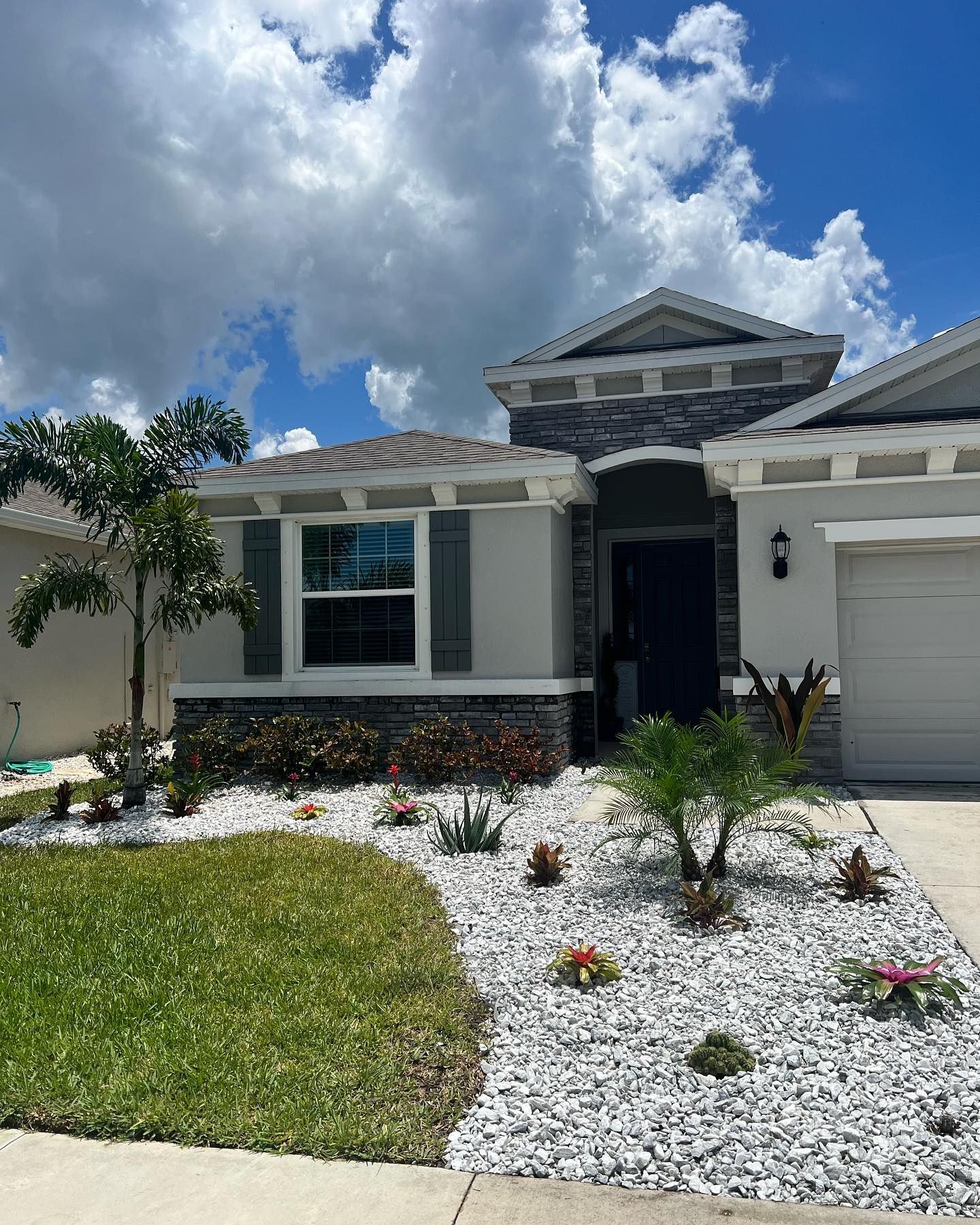 A house with a lot of rocks in front of it