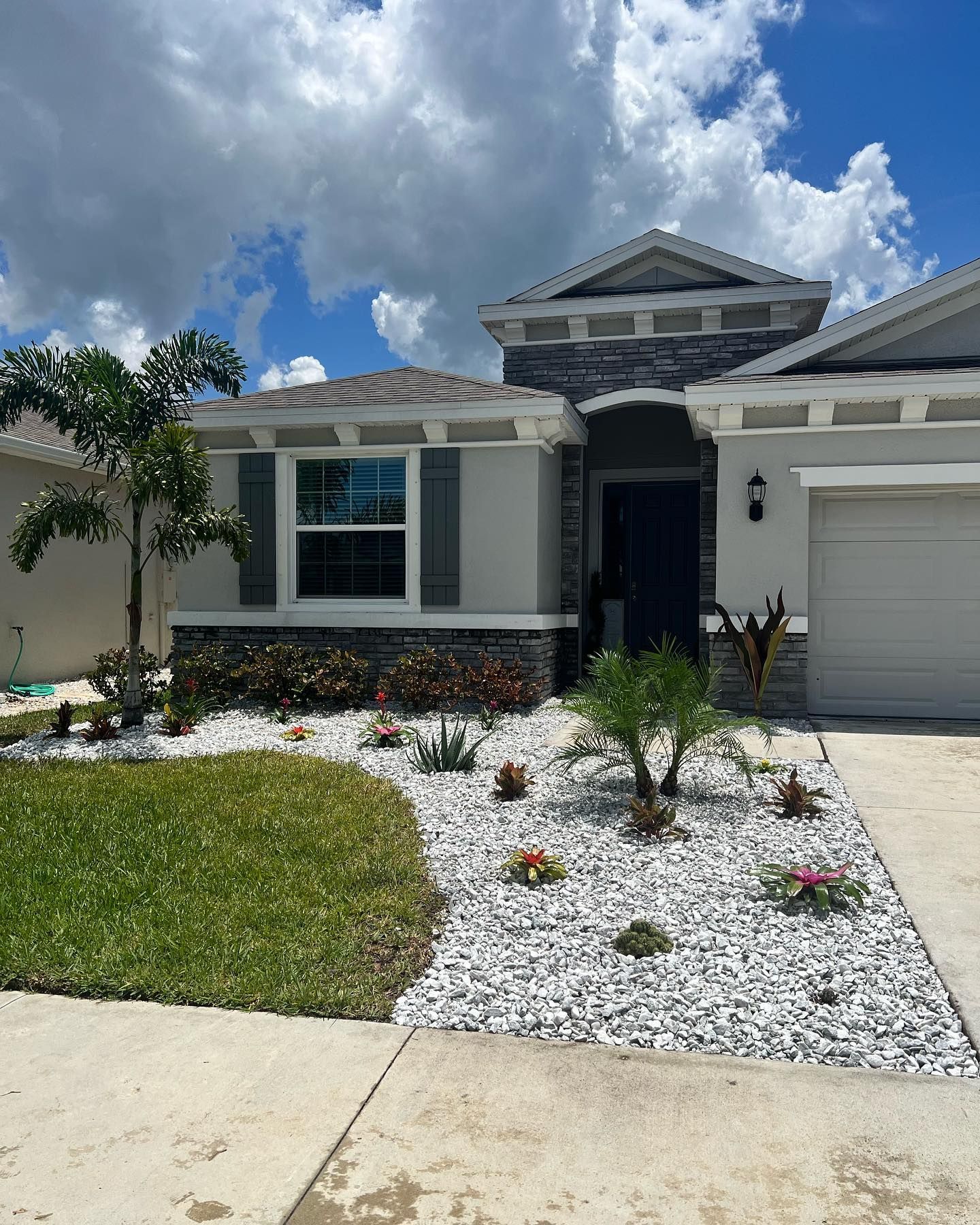 A house with a lot of rocks in front of it
