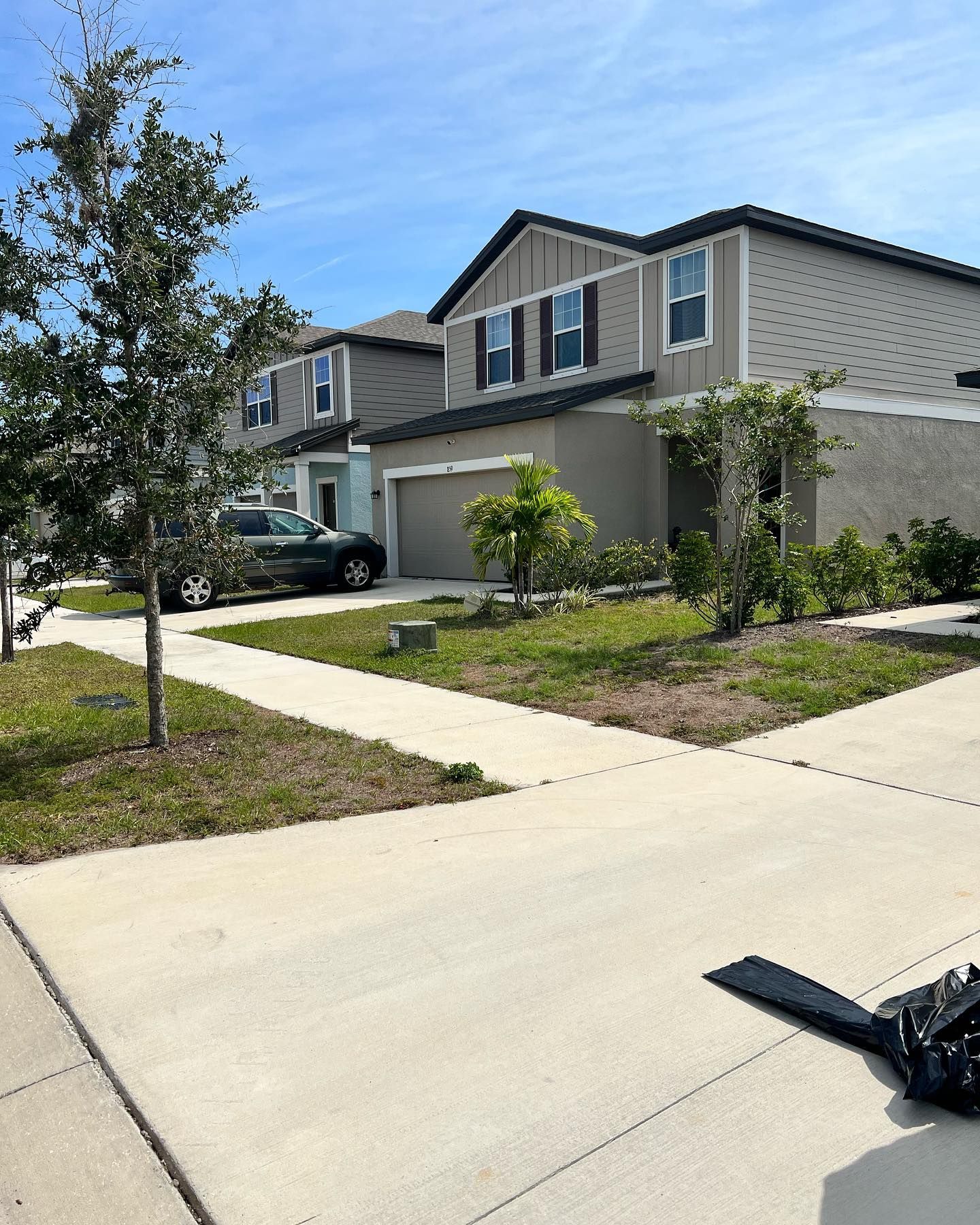 A house with a car parked in front of it