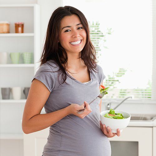 Pregnancy Help — Pregnant Woman Eating Healthy Food in Fresno, CA