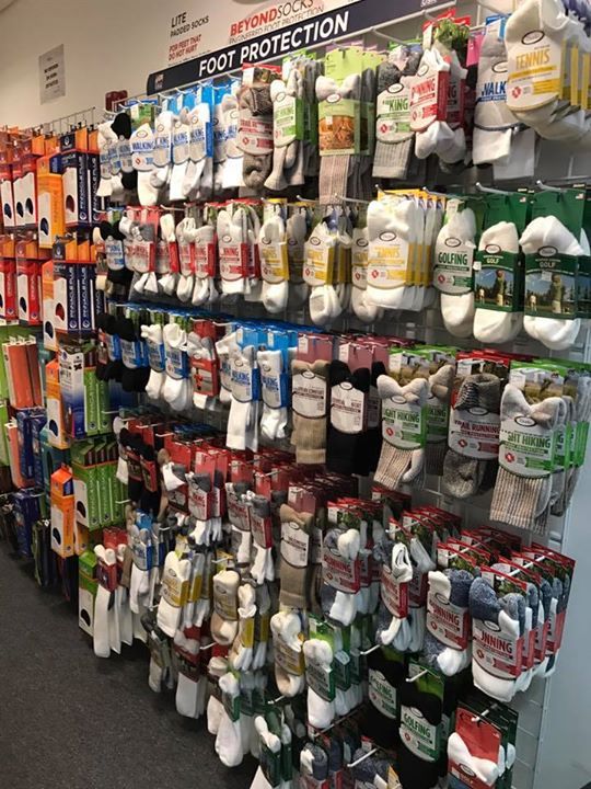 A display of socks and gloves in a store.