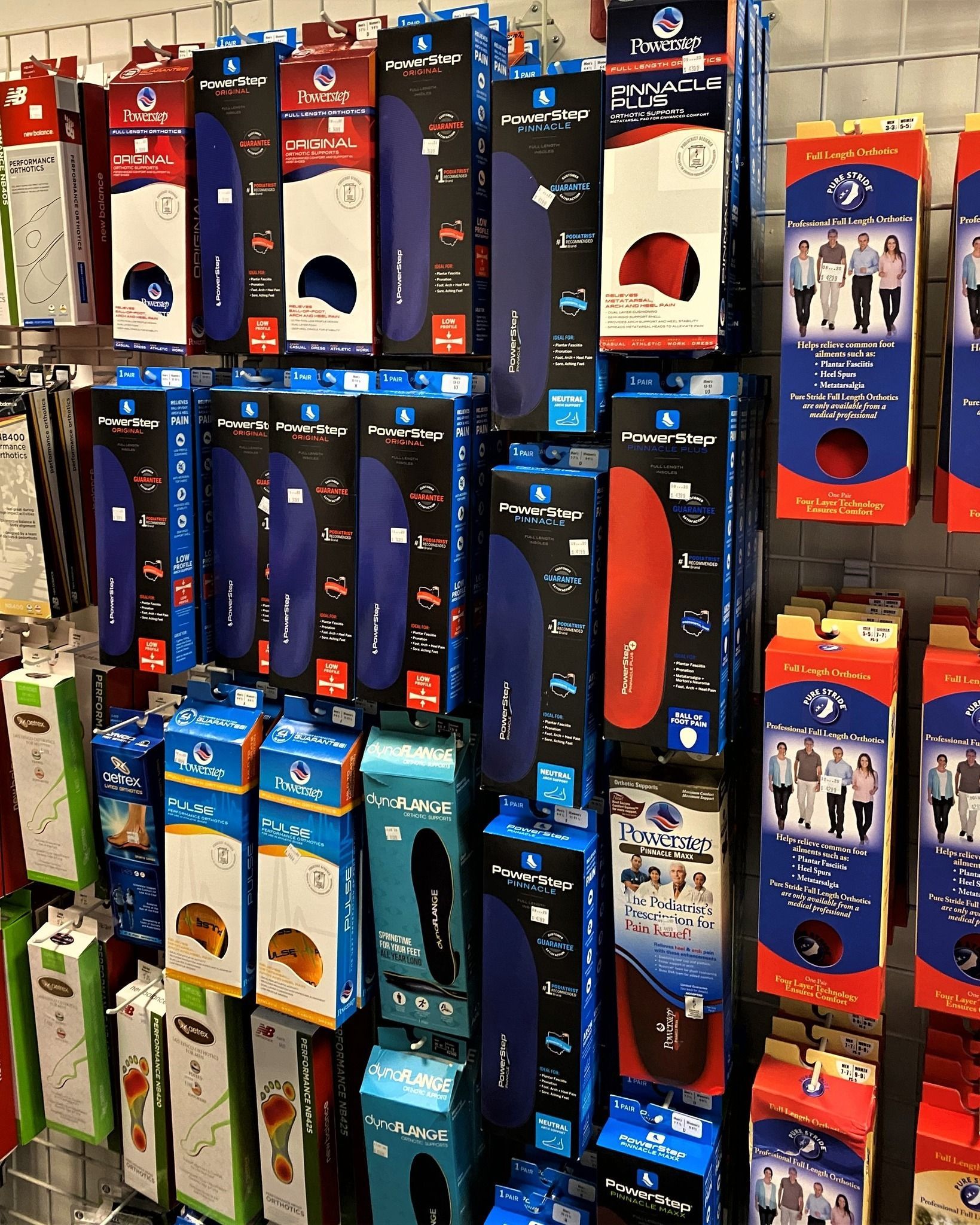 A store shelf filled with lots of different types of insoles.