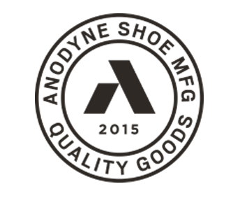A black and white logo for anodyne shoe mfg quality goods