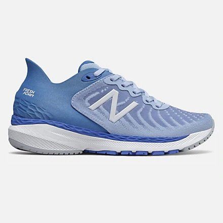 A pair of blue and white new balance running shoes on a white background.
