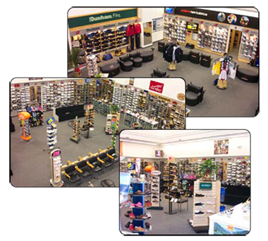 A shoe store with a green sign that says dunham fit