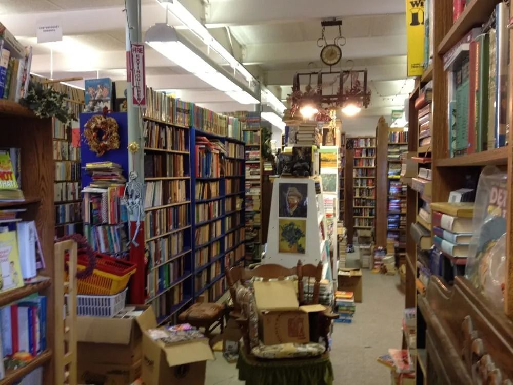 Bookstore interior with rows of books on shelves.