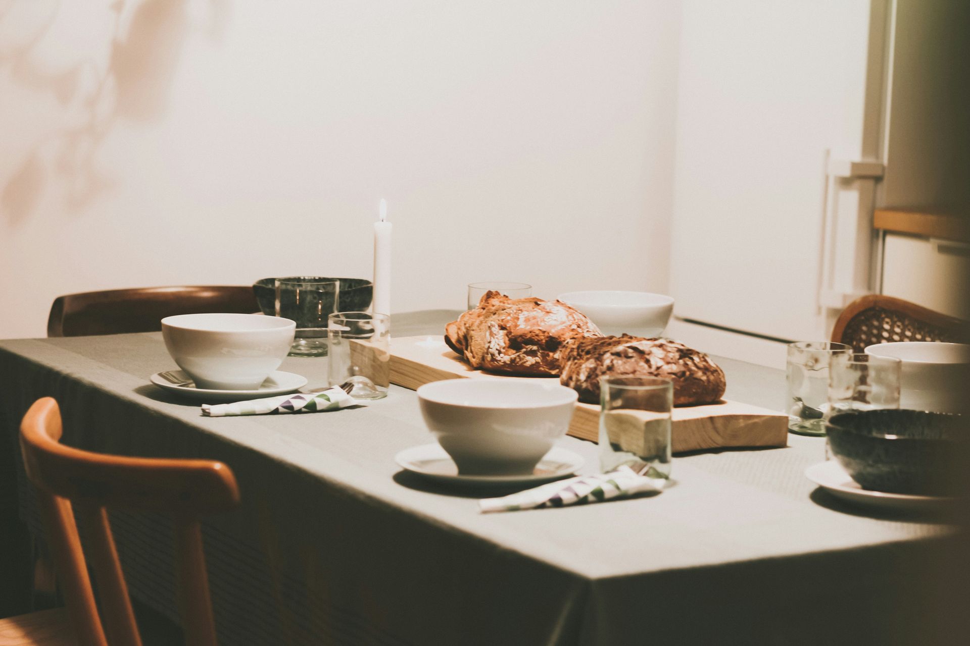 A group of people are sitting around a table eating food.