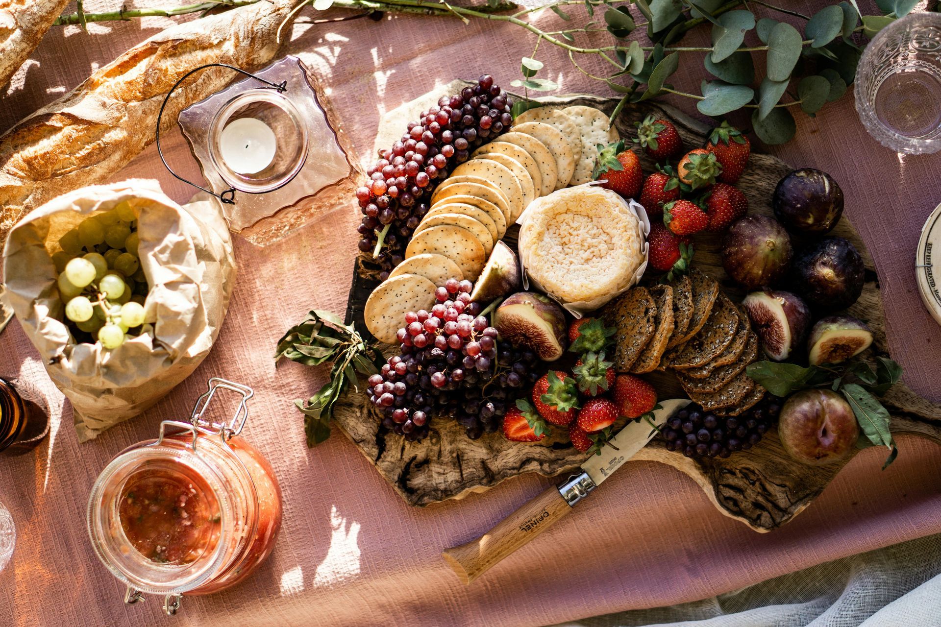 A table topped with a variety of food and drinks.