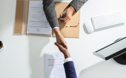 Two businessmen shaking hands.