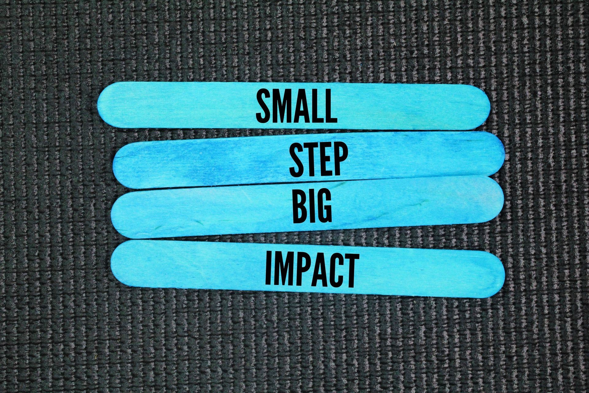 4 paddlepop sticks with witing on them