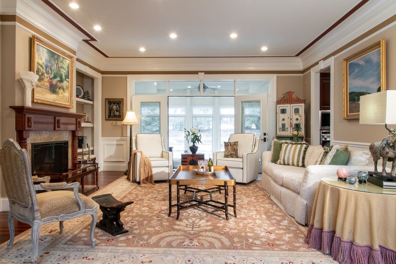 A living room filled with furniture and a fireplace.